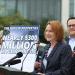 Mayor Durkan at podium announcing funding for a housing initiative.