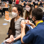 Photo: Person getting vaccinated at Lumen Field Event Center