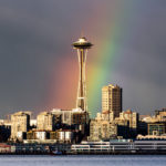 City of Seattle skyline with rainbow behind Space Needle
